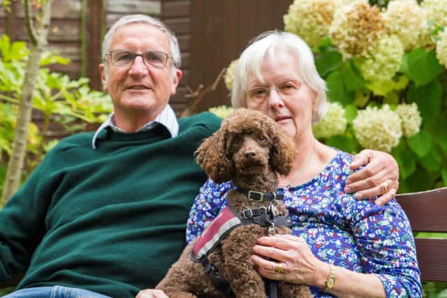 Ann with her husband Malcolm and hearing dog Tegan