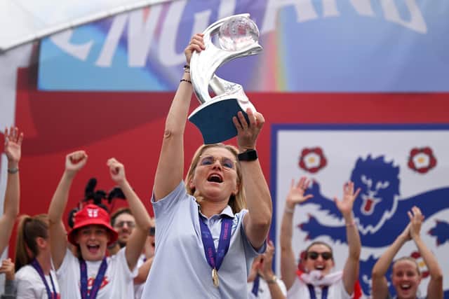 LONDON, ENGLAND - AUGUST 01: Sarina Wiegman, Manager of England lifts the UEFA Womenâ€™s EURO 2022 Trophy during the England Women's Team Celebration at Trafalgar Square on August 01, 2022 in London, England. The England Women's Football team beat Germany 2-1 in the Final of The UEFA European Women's Championship last night at Wembley Stadium.  (Photo by Leon Neal/Getty Images)