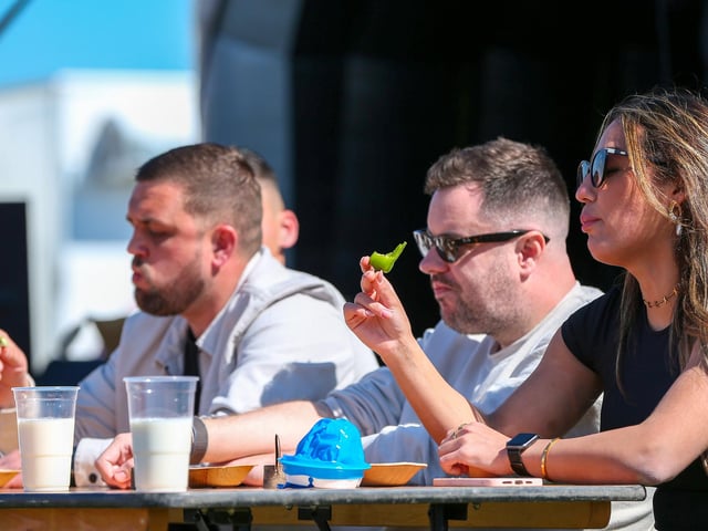 Another chilli anyone? Contestants wait for the heat to hit in the chilli eating contest at Portsmouth Chilli and Gin Festival,