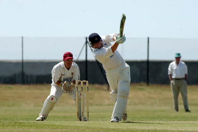 Portsmouth's Derek Kenway hits a six watched by Havant keeper Chris Wrait at St Helens in 2006. Pic: Steve Reid.