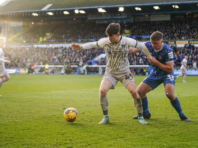 Callum Lang holds off a challenge as he looks to get Pompey on the attack