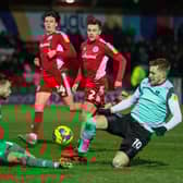 Joe Pigott was sent off for this challenge on Accrington goalkeeper Toby Savin on Tuesday night