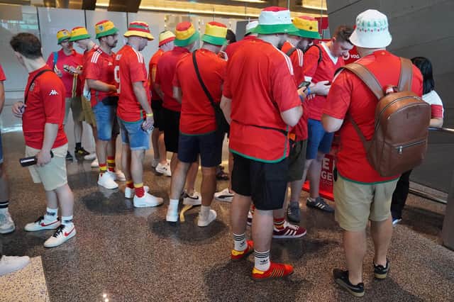 Wales football fans arrive at Hamad International Airport in Doha, Qatar during the FIFA World Cup 2022. Picture date: Monday November 21, 2022.
