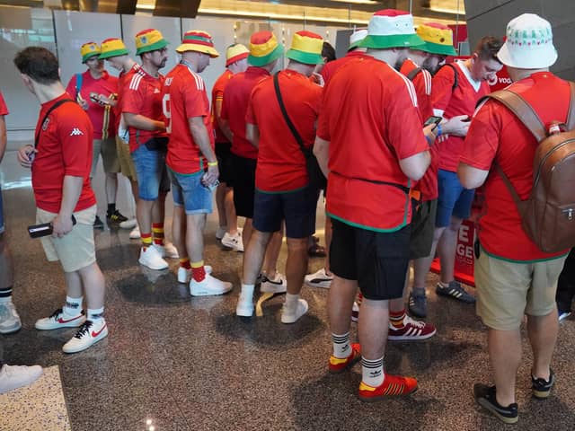 Wales football fans arrive at Hamad International Airport in Doha, Qatar during the FIFA World Cup 2022. Picture date: Monday November 21, 2022.