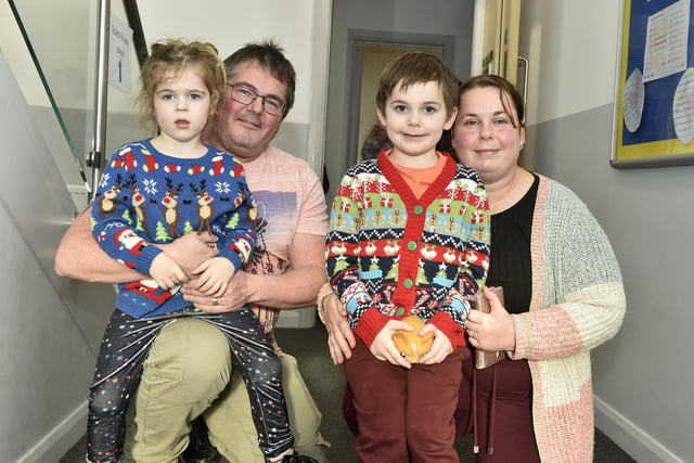 Beacon View Primary Academy in Paulsgrove held their annual community Christmas lunch on Friday, December 22.

Pictured is: Andrew and Donna Grimes with their children Charlotte (4) and Daniel (6).

Picture: Sarah Standing (221223-4068)