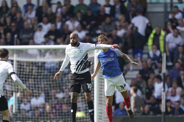 Ryley Towler challenges David McGoldrick in Saturday's 1-1 draw at Derby. Picture: Jason Brown/ProSportsImages