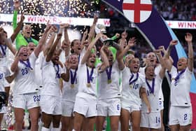 England players celebrate with the trophy following victory over Germany in the UEFA Women's Euro 2022 final at Wembley Stadium, London. Picture date: Sunday July 31, 2022.