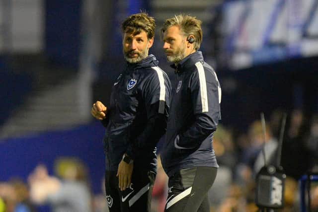 Pompey boss Danny Cowley discusses tactics with brother Nicky during Tuesday night's defeat at the hands of Ipswich    Picture: Graham Hunt