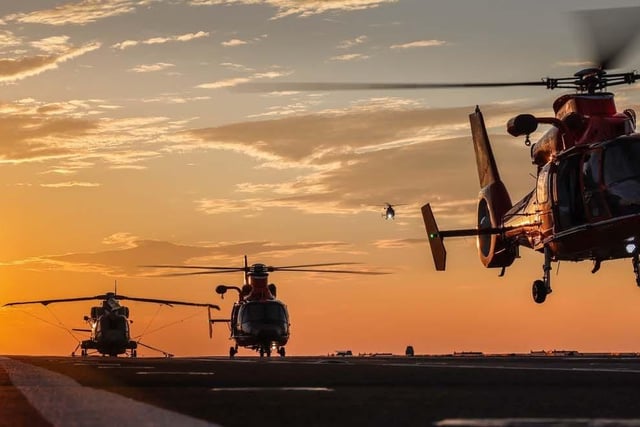 A “very rare” event took place on HMS Prince of Wales during her USA deployment. Procession of US Coast Guard helicopters landed on the carrier's flight deck for the first time, including MH-65E Dolphin aircraft - which are used to intercept drug smugglers and carry out other tasks.