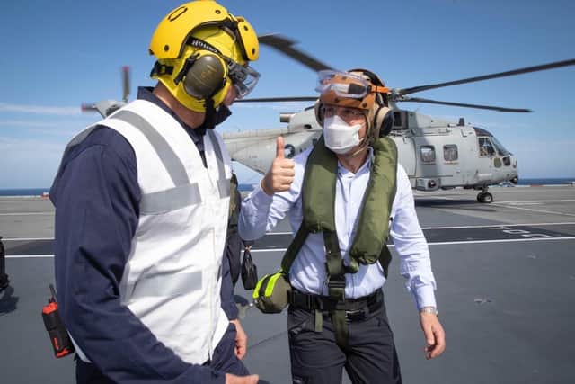 Thumbs up from Nato Secretary General Jens Stoltenberg to a member of  HMS Queen Elizabeth's crew. Photo: Nato