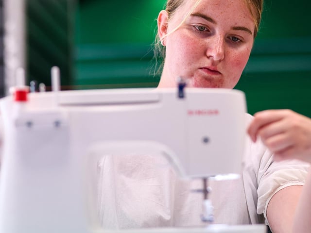 Emma Hounsome at work on a sewing machine. Waterlooville Music and Arts Festival took place in the precinct, Waterlooville
Picture: Chris Moorhouse (170824-65)
