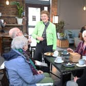 The Rev Annie McCabe with customers at the Host Cafe