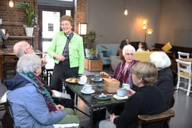 The Rev Annie McCabe with customers at the Host Cafe