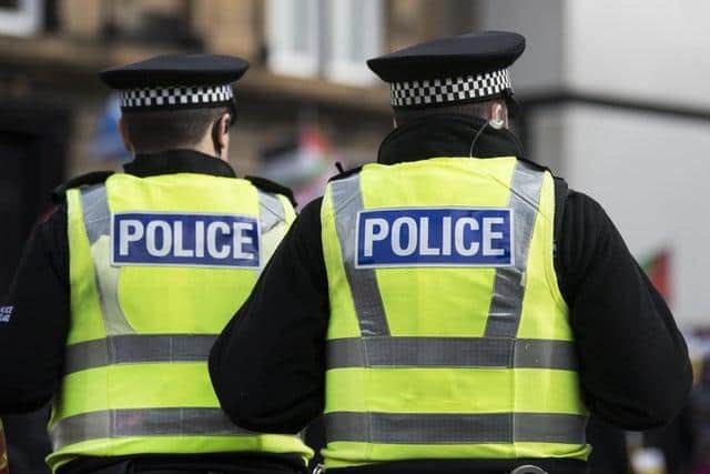 A woman has been arrested after two police officers were threatened in central Fareham yesterday.