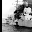 HMS Sheffield burns shortly after being hit by an Argentine Exocet missile, on 4/5/1982, whilst on RADAR picket duties off the coast of the Falkland Islands.