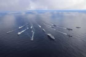 Pictured: HMS Prince of Wales leads the fifteen ship formation as jets fly past.Front row: HMS Prince of WalesRow 2 (L-R): USS Paul Ignatius, ESPS Almirante Juan de Borbon, Row 3 (L-R): HMS Portland, HNLMS Karel Doorman, HNOMS Magnus Lagabote, RFA Tidespring, HNOMS Olav Tyrggvason, ITS Giuseppe Garibaldi, FS NormandieRow 4 (L-R): RFA Mounts Bay, HNOMS Otto Sverdrup, HNOMS Gnist, Kv Bjornoya, FGS Bonn