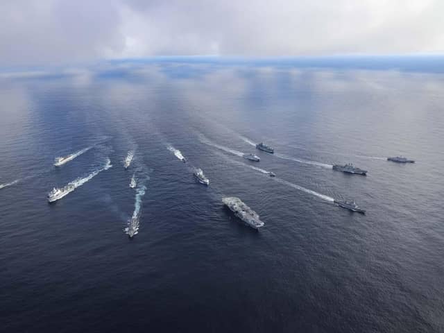 Pictured: HMS Prince of Wales leads the fifteen ship formation as jets fly past.Front row: HMS Prince of WalesRow 2 (L-R): USS Paul Ignatius, ESPS Almirante Juan de Borbon, Row 3 (L-R): HMS Portland, HNLMS Karel Doorman, HNOMS Magnus Lagabote, RFA Tidespring, HNOMS Olav Tyrggvason, ITS Giuseppe Garibaldi, FS NormandieRow 4 (L-R): RFA Mounts Bay, HNOMS Otto Sverdrup, HNOMS Gnist, Kv Bjornoya, FGS Bonn