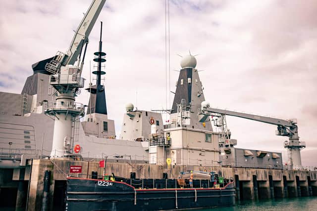 Type 45 destroyer HMS Diamond pictured alongside at the Upper Harbour Ammunition Facility in Portsmouth, where warships are rearmed safely. Photo: Royal Navy