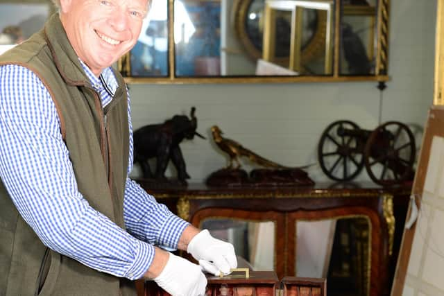 Charles Wallrock with the medicine cabinet that belonged to Sir William Beatty, Nelson's surgeon at Trafalgar. 