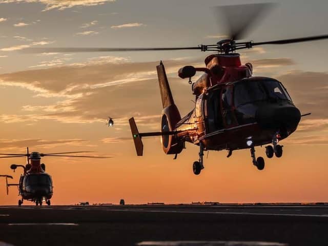 United States Coast Guard Dolphins conduct night flying with HMS Prince Of Wales. Picture: LPhot Finn Stainer-Hutchins.