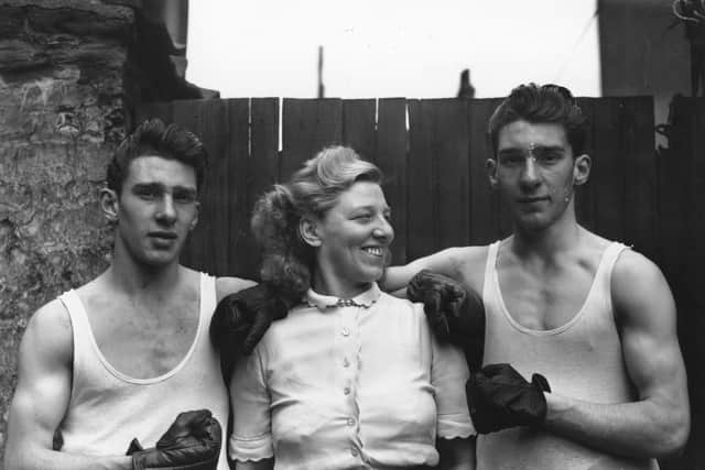 Reggie and Ronnie Kray as amateur boxers, picture with their mother, Violet. Picture Fox Photos/Getty Images