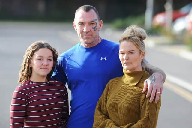 Pictured is: Reece's sister Annie Thompson (13), mum April Thompson (48) and step dad Malcolm Hall (49).

Picture: Sarah Standing (021120-8607)