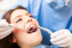 Woman receiving a dental treatment. Picture: Adobe Stock