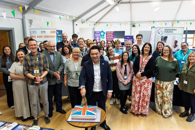 Alan Mak MP cuts a special celebration cake at his 10th annual Jobs, Apprenticeships and Careers Fair at Bedhampton Community Centre