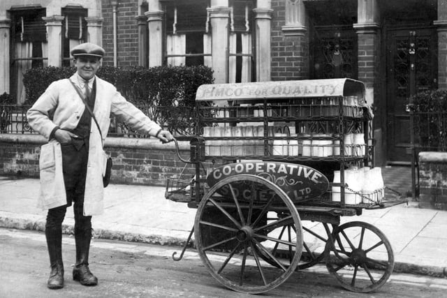 Milkman Len Garland taken in Froddington Road Fratton in 1926.Len had a push along milk float. Evidently he went back to the dairy twice on his round to complete his deliveries. He was working for the Portsea Island Mutual Co-op which was very big in Portsmouth in more ways than just milk. There also seems to be half-pint bottles of milk as well. Len died in 1996 aged 94. Picture: Costen.co.uk