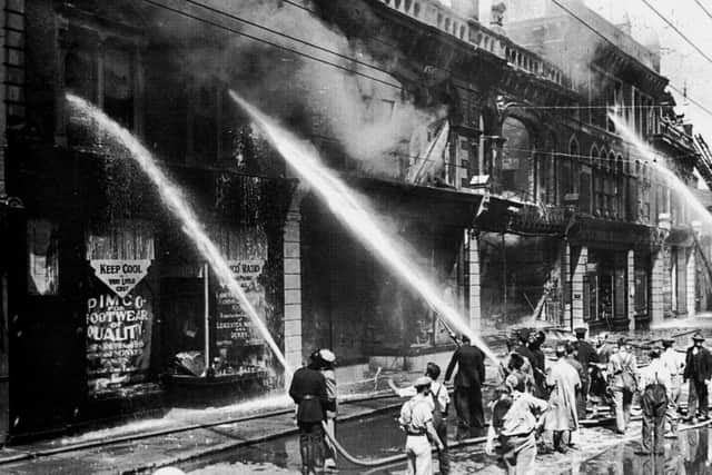 Fratton Road,1934, with Co-operative House blazing.