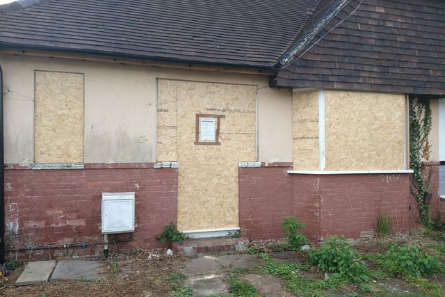 This bungalow in Lansdowne Avenue, Portchester, has been boarded up for years - and neighbours are fed up with looking at it.