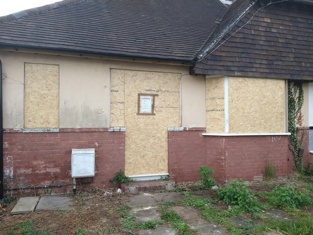 This bungalow in Lansdowne Avenue, Portchester, has been boarded up for years - and neighbours are fed up with looking at it.