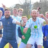 Tom Jeffes (middle) and his US Portsmouth team-mates celebrate  last weekend's FA Vase fifth round victory at Tavistock. Picture: Martyn White.