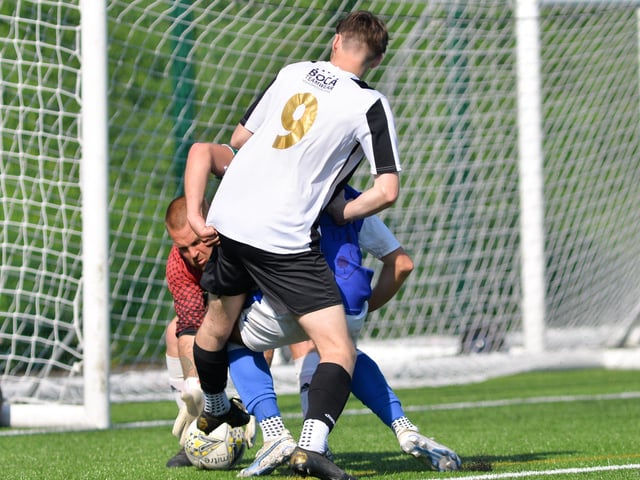 Denmead (blue) v Hayling. Picture by Martyn White