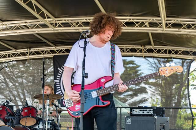 Bassist Jack Smith, 23, and drummer Hannah Websdale from the band Cuurls performing at Live at the Band Stand from Castle Field. Picture: Mike Cooter (120622)