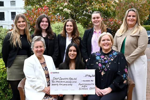 Head Girls present cheque to Claire Lambon, CEO, Stop Domestic Abuse