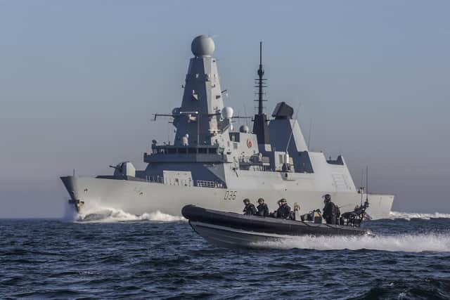 HMS Defender carrying out her £3.3m drugs bust in the Middle East. Picture: Royal Navy