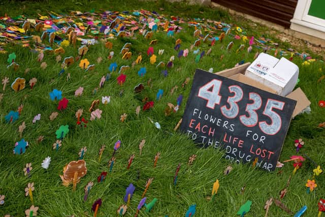 Flowers were spread to represent lives lost to drugs Picture: Alex Shute