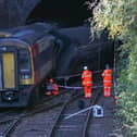 Investigators at the scene of a crash involving two trains near the Fisherton Tunnel between Andover and Salisbury in Wiltshire. Steve Parsons/PA Wire