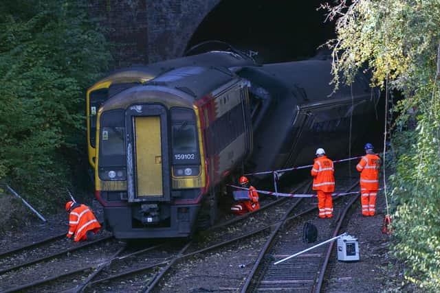 Investigators at the scene of a crash involving two trains near the Fisherton Tunnel between Andover and Salisbury in Wiltshire. Steve Parsons/PA Wire