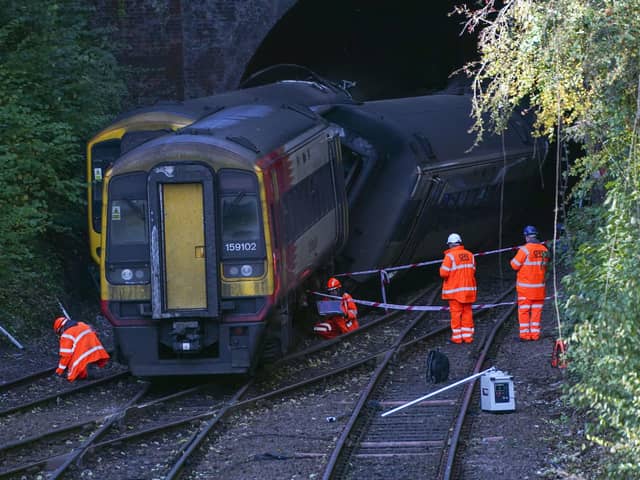 Investigators at the scene of a crash involving two trains near the Fisherton Tunnel between Andover and Salisbury in Wiltshire. Steve Parsons/PA Wire