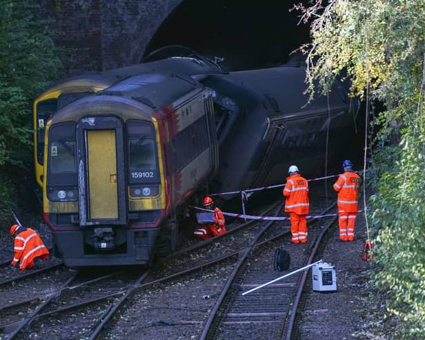 Investigators at the scene of a crash involving two trains near the Fisherton Tunnel between Andover and Salisbury in Wiltshire. Steve Parsons/PA Wire