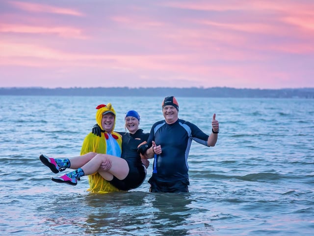 A sparse smattering of brave swimmers plunged into the sea at Stokes Bay where normally hundreds go for the annual New Year’s Day swim

Picture: Mike Cooter