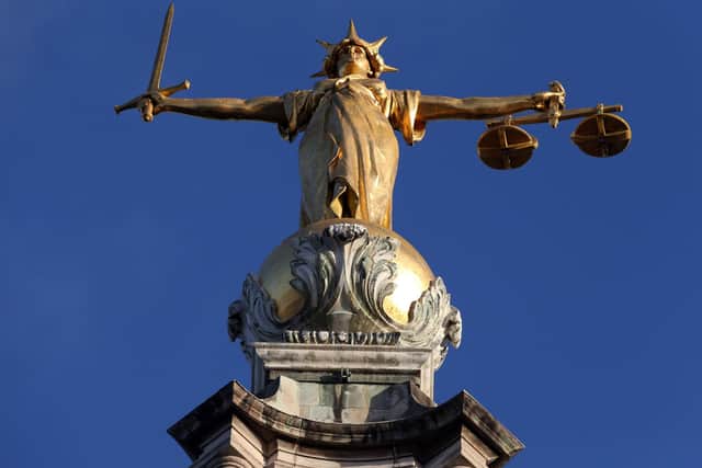 Statue of Lady Justice atop the Central Criminal Court building at the Old Bailey, London. Plans to see serious violent and sexual offenders spend longer behind bars by scrapping automatic release half-way through a jail sentence are to be debated by MPs. Pic PA