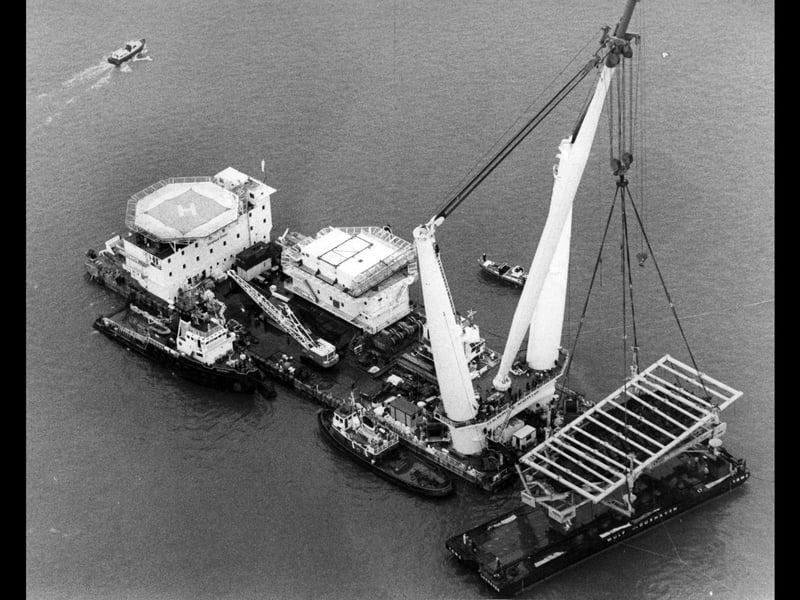 An aerial shot of the giant Tog Mor crane lowering the Mary Rose onto her barge on October 11, 1982. The News PP3739