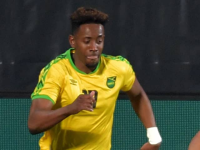 Jamaica's forward Jamal Lowe (L) and United States' defender Reggie Cannon vie for the ball during the FIFA World Cup Qatar 2022 friendly preparation football match USA v Jamaica in Wiener Neustadt, Austria, on March 25, 2021. (Photo by JAKUB SUKUP / AFP) (Photo by JAKUB SUKUP/AFP via Getty Images)