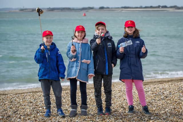 Chernobyl children are litter picking on Southsea beach opposite Clarence Pier on 17 March 2020.
Pictured: Danylo 10, Ivanna 11, Serhiy 10 and Olha 11 picking up litter.
Picture: Habibur Rahman