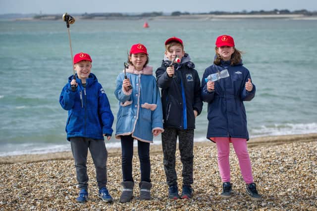 Chernobyl children are litter picking on Southsea beach opposite Clarence Pier on 17 March 2020.

Pictured: Danylo 10, Ivanna 11, Serhiy 10 and Olha 11 picking up litter.

Picture: Habibur Rahman