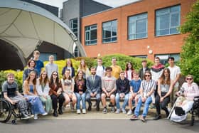 Students celebrating their achievements, pictured with principle Rob Temple.