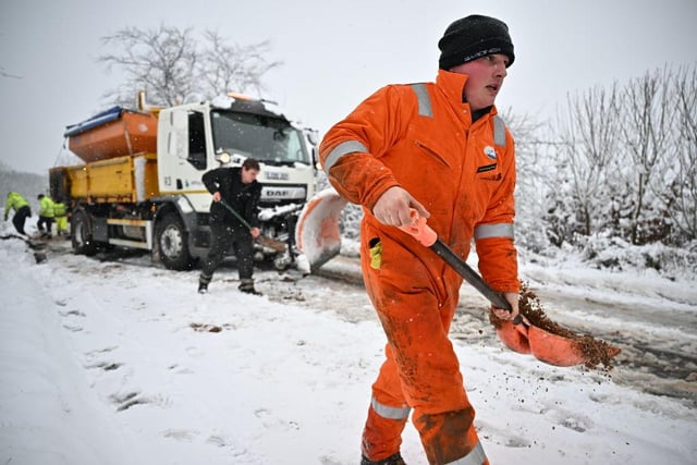 Council teams get to work in the snow on Friday morning in Balfron, Scotland. (Photo by Jeff J Mitchell/Getty Images)